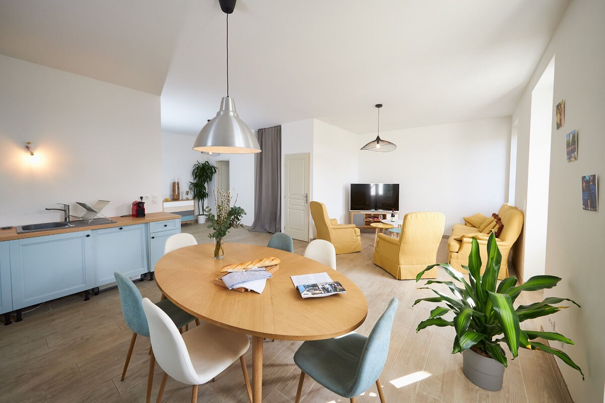 Host interior with table, TV and kitchen