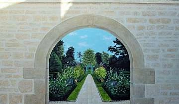 trompe l'oeil sur mur extérieur.Mur en fausses pierre donnant sur un jardin à la française